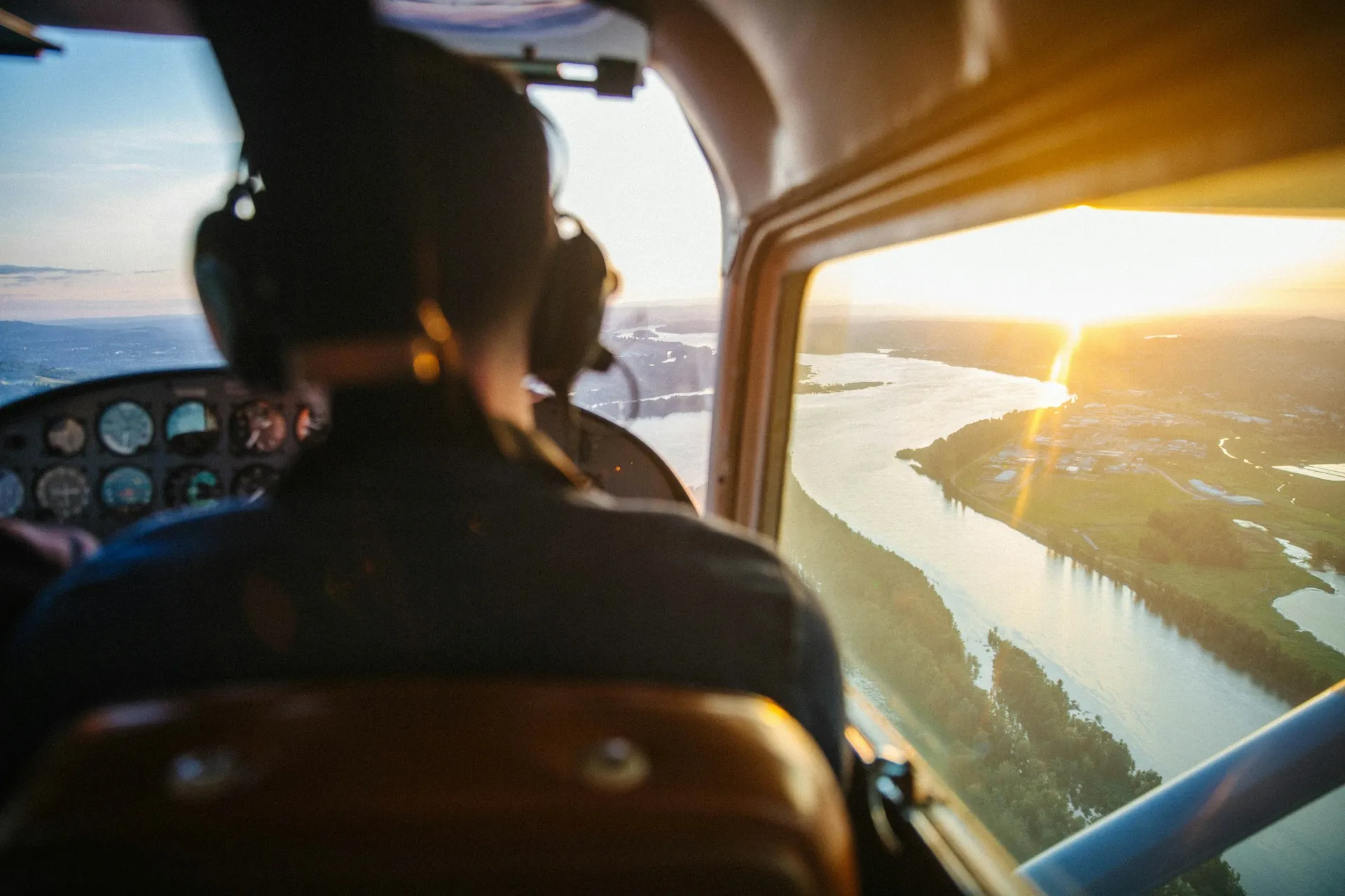 Elite Flight Training academy private pilot student viewed from the back seat of a cessna airplane